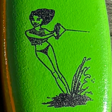 Illustration of a waterski girl on a green vinyl coated floaty keychain.